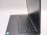 a laptop that is sitting on a white table