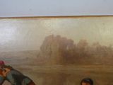 deux personnes qui se tiennent devant un tableau