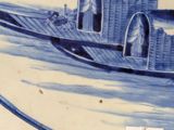 a blue and white plate with a boat on it