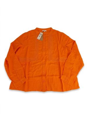 a close up of an orange shirt on a white background