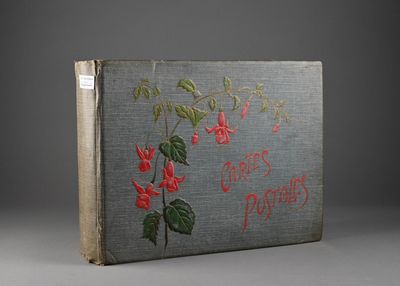 an old book with a picture of a flower on it