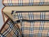 a close up of a piece of luggage with a checkered pattern
