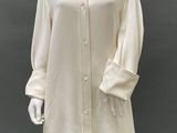 an image of a mannequin wearing a white shirt dress