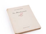 the book is open on a white surface with a white background