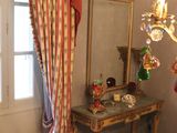 an image of a bedroom with a bed and a mirror