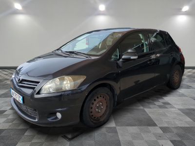 a picture of a black car parked in a garage