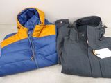 two jackets that are next to each other on the floor