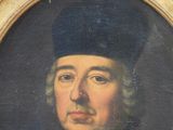 portrait of a man wearing a black hat and a black coat