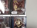 several star wars action figures are stacked on top of each other