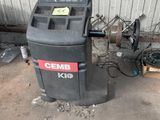 a trash can sitting next to a trash can in a garage