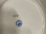 a white plate with a blue and white design on it