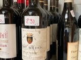 several bottles of wine are lined up on a counter