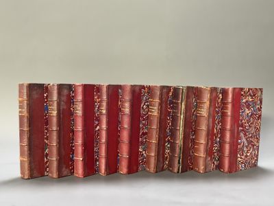an image of a row of red books sitting on top of a table