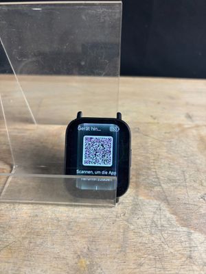 a smart watch with a qr code on the screen