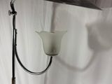 a lamp that is sitting on a stand on a white background