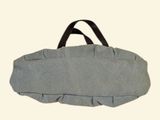 a gray bag with a black handle on a white background