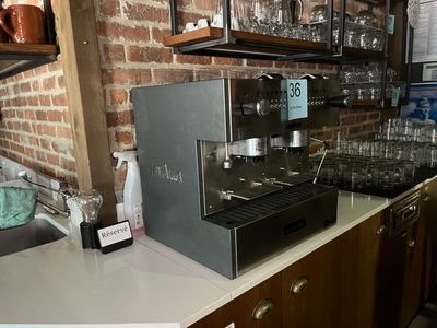 a coffee machine sitting on a counter in a kitchen