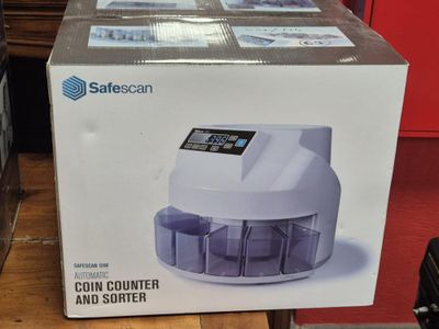 a box with a coin counter and sorter inside of it