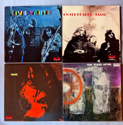 quatre albums vinyle des Rolling Stones, dont l'un comporte la photo d'un homme et d'une femme