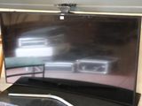 a flat screen tv sitting on top of a table