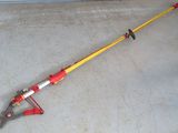 a red and yellow pole that is on the ground