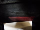 a black bag with a red label on it