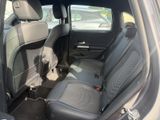 the back seats of a car are empty in a parking lot