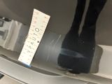a measuring tape on the back of a toilet seat