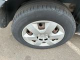 a close up of a tire on the side of a car