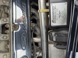 a close up view of a motorcycle engine with the cover open