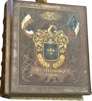 an old book with a coat of arms on it