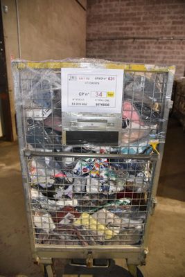 a metal cart with a bunch of items in it