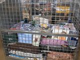 a metal cage filled with lots of items inside of it