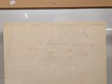 a piece of paper with writing on it in a glass case