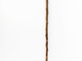 a close up of a wooden stick with a handle on a white background