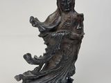 an image of a statue of a woman with a bird in her hand
