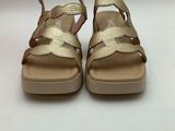 a close up of a pair of sandals on a white surface