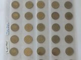 a lot of coins in a plastic bag on the table