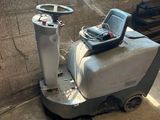 a machine that is sitting on the floor in the room