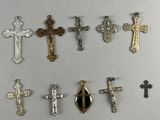 a close up of a group of crosses on a white surface