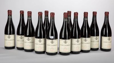 six bottles of red wine lined up in a row