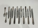an assortment of silverware including knives, forks and spoons