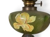 a lamp that has a yellow flower on it