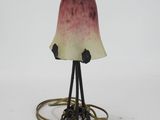 an image of a lamp with a bird on it