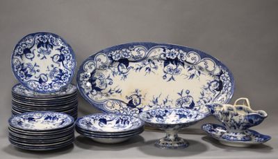 many plates and bowls that are sitting on a table