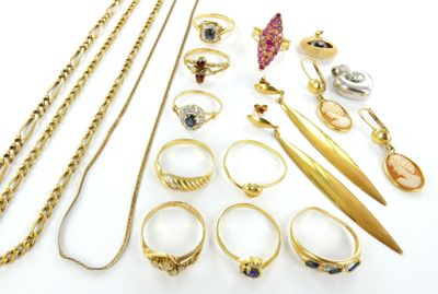 many different types of rings and necklaces on the table