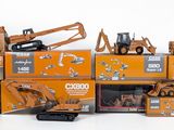 many different models of construction equipment in a pile