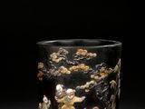 an image of a black and gold decorated glass vase