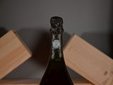 a bottle of wine that is sitting on a table