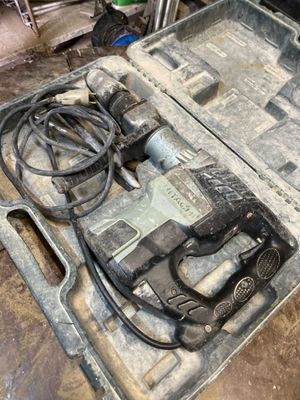 a tool box with tools in it sitting on the floor